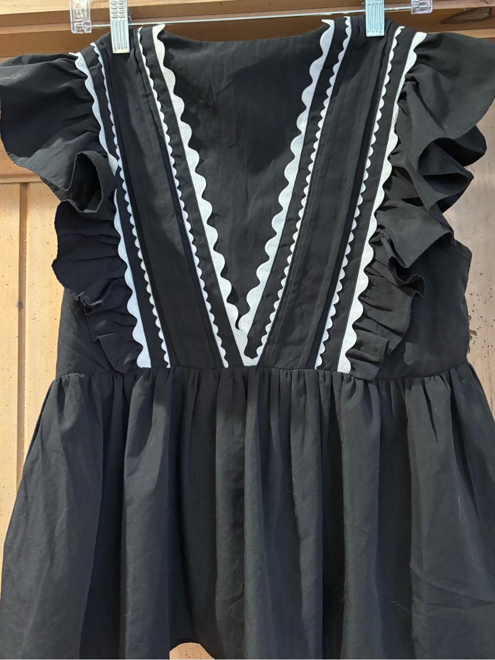 entro Black top with White Trim and Ruffle Sleeves